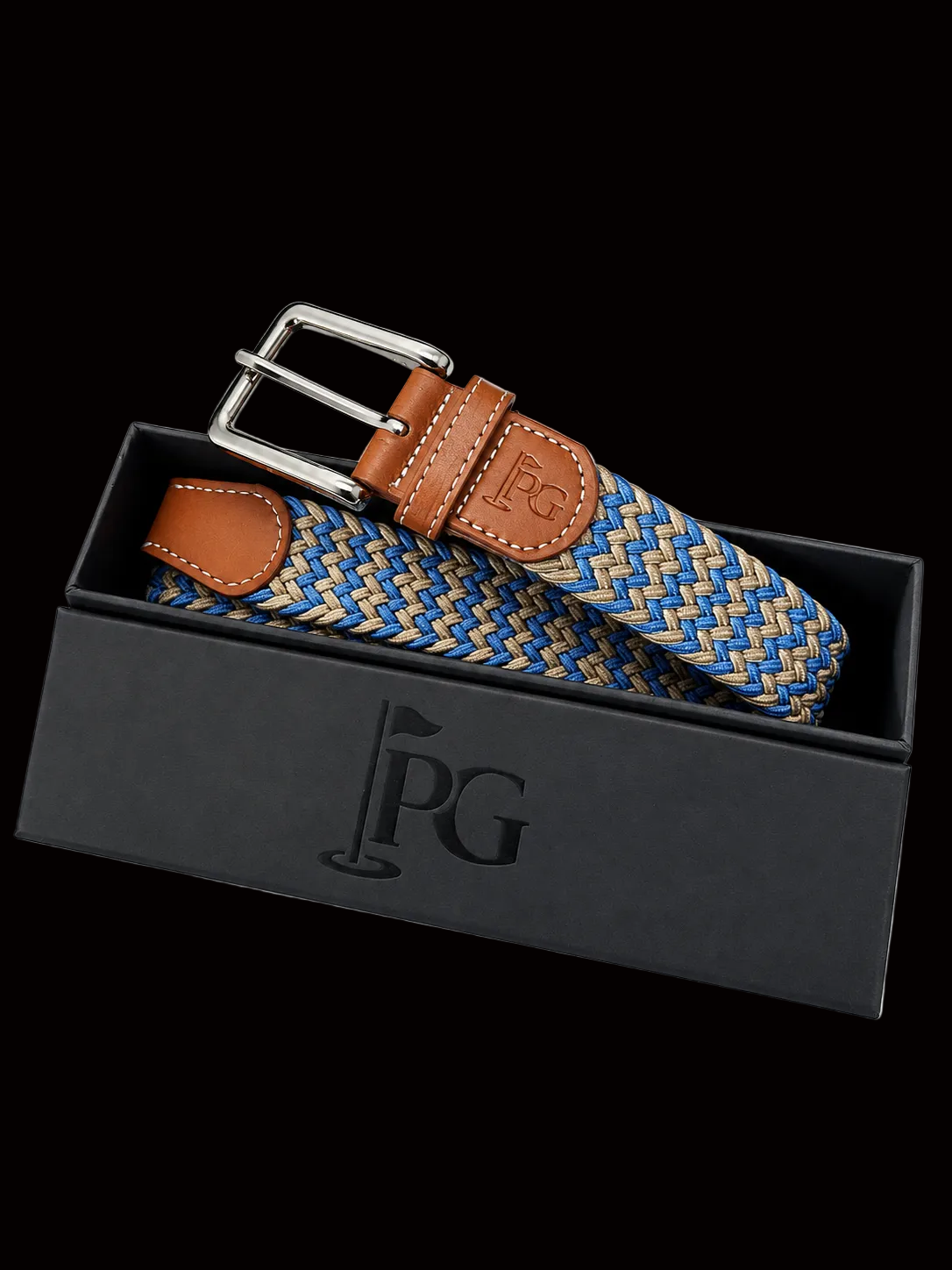 A PG brand woven belt with a blue, beige, and white pattern, brown leather accents, and a silver buckle